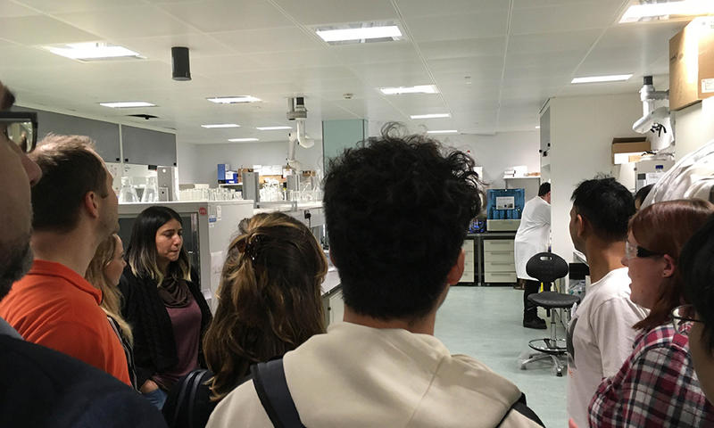 photo of lab manager giving students tour