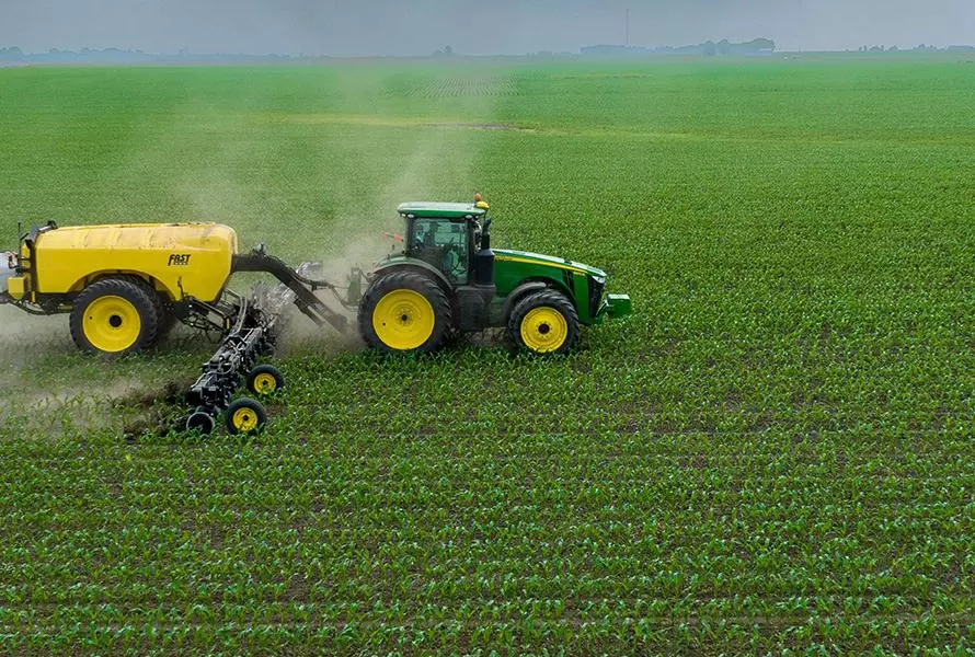 photo of tractor spreading chemicals